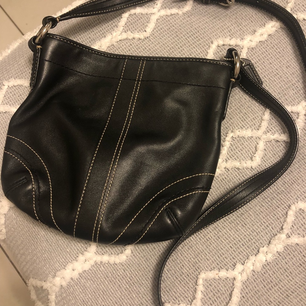 Black Coach crossbody with adjustable length strap
